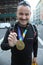 Unidentified 2015 New York City Marathon runner wears medal in Manhattan