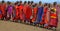 Unidentified African people from Masai tribe prepare to show