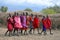 Unidentified African people from Masai tribe prepare to show