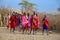 Unidentified African people from Masai tribe prepare to show