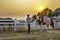 Unidentified Asia cowboy Farmer training house walking with cowgirl at sunset in beautiful Montana Village  on February 16 2019,