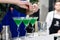 Unidentified barman adding coconut shaving in a martini glass, s