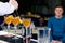 Unidentified barman preparing cocktail at the bar counter, shall