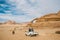 Unidentified bedouins with a caravan of camels walks in the desert of Wadi Rum
