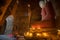 Unidentified Buddhism neophyte prays in Buddihist temple