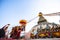 Unidentified Buddhist pilgrims near stupa Boudhanath during festive solemn Puja