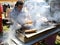 Unidentified Chef cooking Turkish Kofte kebab