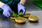 Unidentified chef preparing appetizing burgers