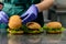 Unidentified chef preparing appetizing burgers