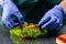 Unidentified chef preparing delicious juicy burger