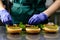 Unidentified chef preparing veggie burgers with yummy vegetable