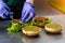 Unidentified chef preparing veggie burgers with yummy vegetable