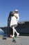 Unidentified family taking picture in the front of the Unconditional Surrender sculpture