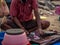 Unidentified fisherman cutting freshly catch fish in Malvan fish market