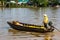 Unidentified fisherman fishing in a canoe