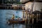 Unidentified fisherman prepare the fishing net at small boat