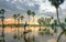 Unidentified fishers throw fish net to catch fish a lake