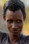 Unidentified Fulani skinny man stands in the village. Fulanis (