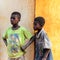Unidentified Ghanaian boys talk about something in the local vi