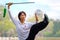 Unidentified group of people practice Chinese sword with Tai Chi Chuan in a park