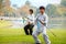 Unidentified group of people practice Chinese sword with Tai Chi Chuan in a park