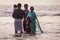 Unidentified Hindu family do holy bathe at the sacred confluence on Papanasam beach