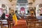 Unidentified indian people praying during holy mass in christian church in India