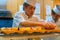 Unidentified Japanese sushi chef prepares dishes of japanese traditional sushi