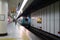 Unidentified Japanese wait for train on a platform in Kyoto,