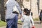 Unidentified Jewish mother holding her daughter`s hand and walki