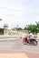 Unidentified khmer man in helmet riding motorcycle on the street in Battambang, West Cambodia