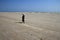 An unidentified lady walks over the wide shores in Dhanushkodi, Tamil Nadu, India.