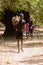 Unidentified local boy carries some bush in a village of the Ca