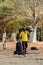 Unidentified local man carries bags on the coast of the Orange