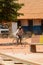 Unidentified local man rides a bicycle in a village in Guinea B