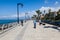 An unidentified locals walk along the beach around quay in Beirut