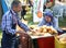 Unidentified man cutting breads for kofte kebabs