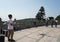 Unidentified man operator controlling a large drone near Tian Tan Buddha