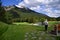 An unidentified man is playing golf in middle of amazing landscapes.