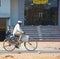 Unidentified man rides bicycle in rural Rajasthan