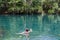 An unidentified man swimming at Berry Springs, a fresh water spring in the Northern Territory