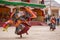 Unidentified monk in mask perform a religious masked and costumed mystery dance of Tibetan Buddhism