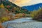 the unidentified mountain resort hotel in the background of Azusa river and colorful autumn trees at Kamikochi, Nagano pref.