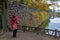 Unidentified Muslim woman in hijab takes photograph of autumn season colours at Osaka Castle Park