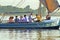 Unidentified people on an excursion on the Nile River in felucca traditional wooden sailing boat, Luxor, Egypt