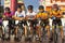 Unidentified people group ride of bicycle travel in the city