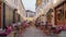 Unidentified people sits in cozy outdoor cafe in Gjirokastra old town