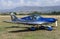 Unidentified people visit small sports planes at the aviation rally, Stanesti aerodrome, Gorj, Romania