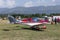 Unidentified people visit small sports planes at the aviation rally, Stanesti aerodrome, Gorj, Romania