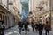 Unidentified People Walking at Famous Historical Shopping Street Getreidegasse in Salzburg.